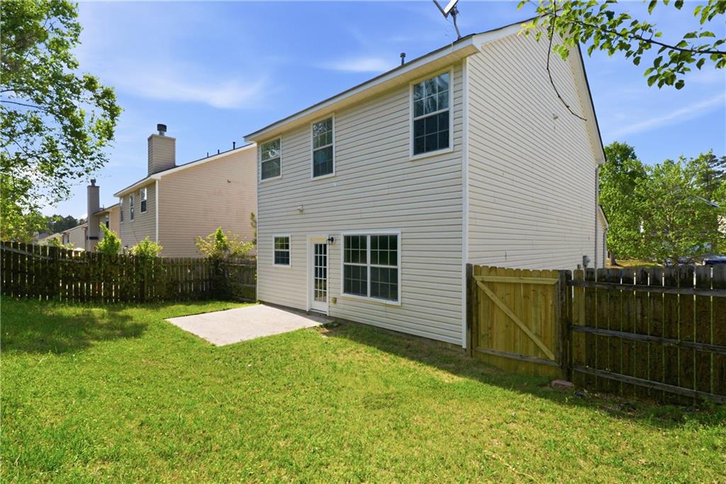 6065 Hemperly Road College Park, GA 30349 - Photo 17 of 18 a view of a backyard with plants and a small yard