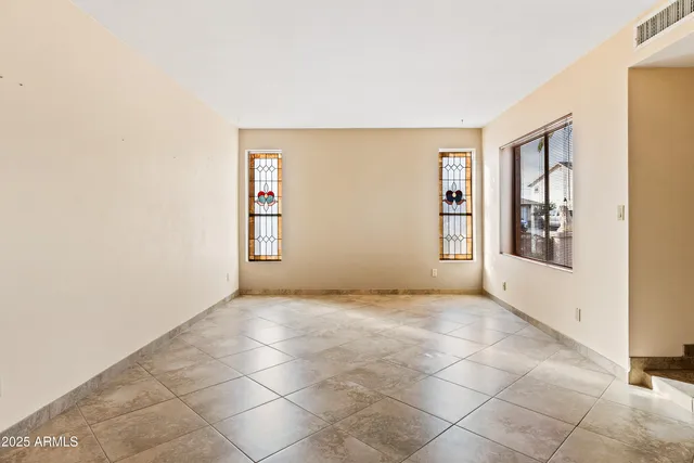 an empty room with windows