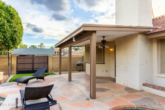 a backyard of a house with seating space