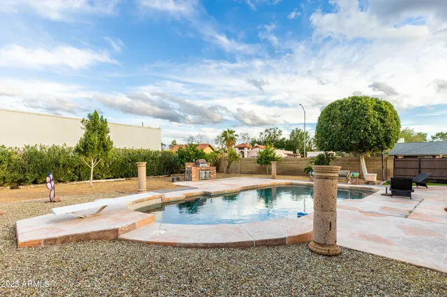 a view of a swimming pool with a patio