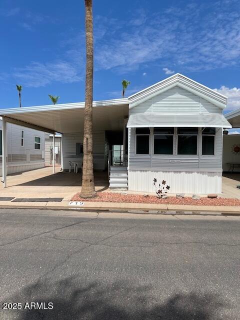 3710 South Goldfield Road Apache Junction, AZ 85119 - Photo 1 of 14 a front view of a house with a yard