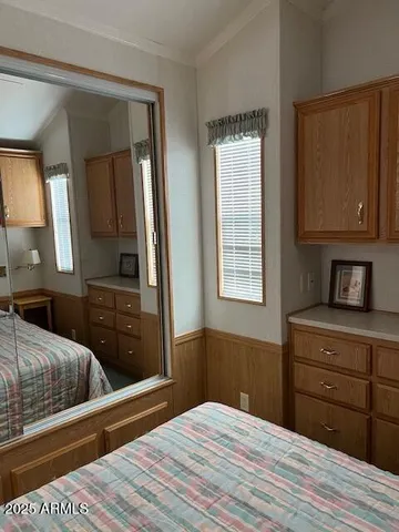 a bedroom with a bed and a dresser