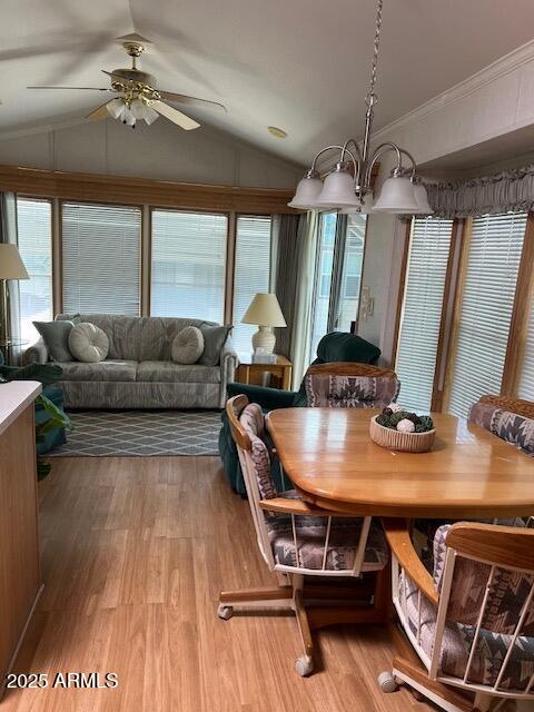 3710 South Goldfield Road Apache Junction, AZ 85119 - Photo 3 of 14 a living room with furniture a chandelier and a wooden floor