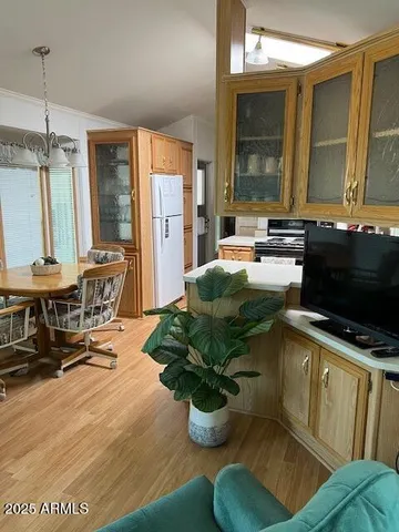 a kitchen with a table chairs and a dining table