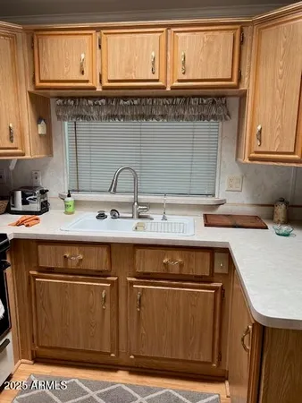 a kitchen with a sink and cabinets