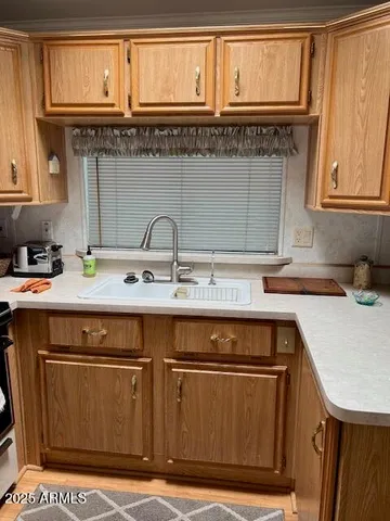 a kitchen with a sink and cabinets