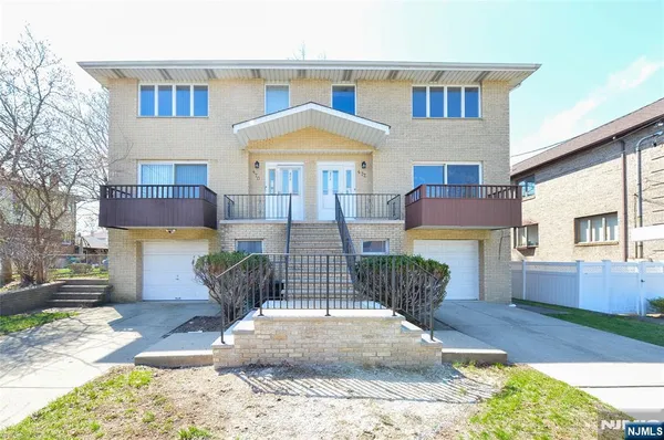 a view of a patio with couches table and chairs