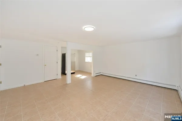 an empty room with a empty space and window