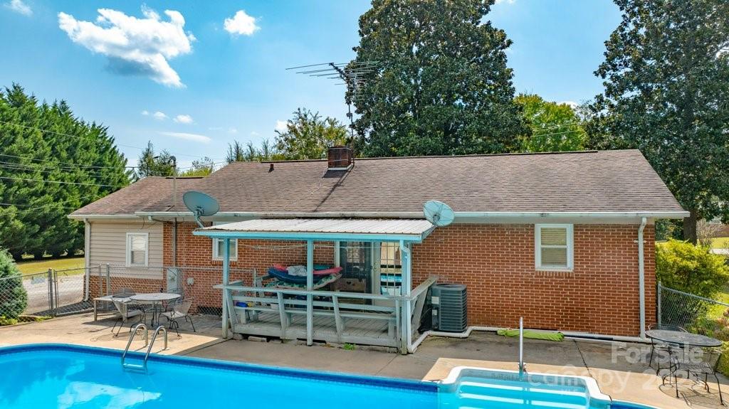 489 Ned Mcgimsey Road Nebo, NC 28761 - Photo 15 of 25 a backyard of a house with yard table and chairs