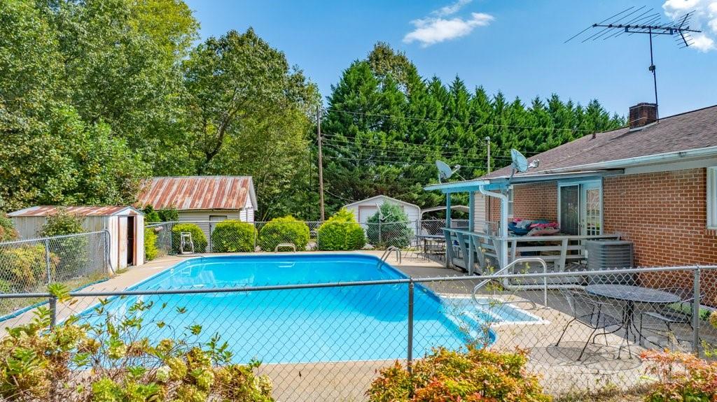 489 Ned Mcgimsey Road Nebo, NC 28761 - Photo 17 of 25 a view of a chairs and table in the patio