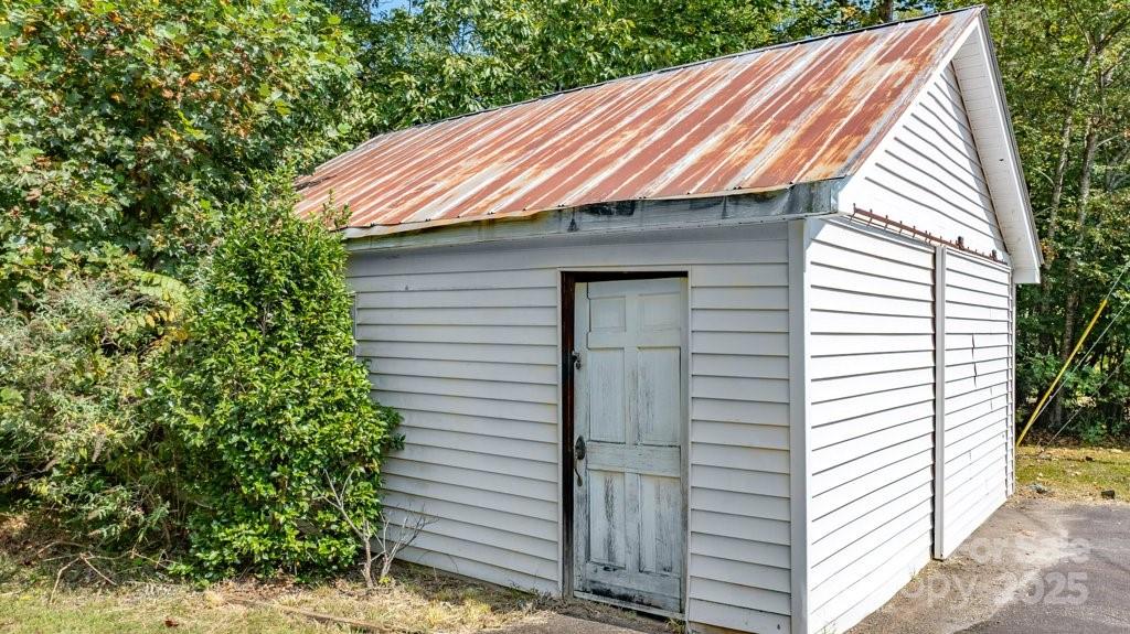 489 Ned Mcgimsey Road Nebo, NC 28761 - Photo 21 of 25 a front view of a house with a garden