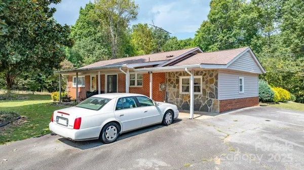 a view of a car parked in front of a house