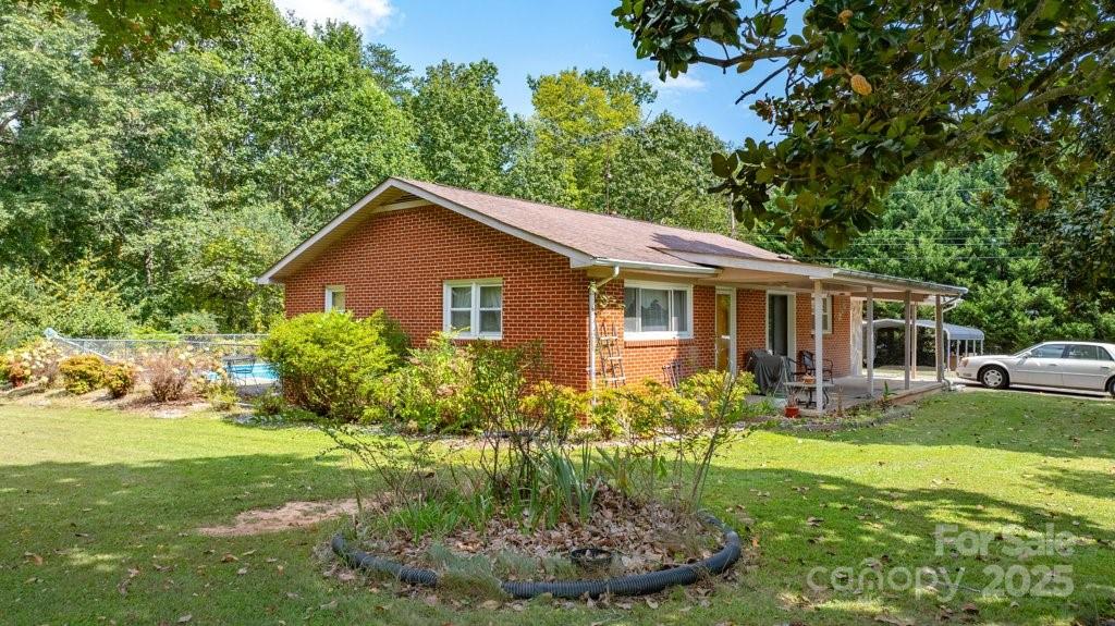 489 Ned Mcgimsey Road Nebo, NC 28761 - Photo 4 of 25 a front view of house with yard and green space