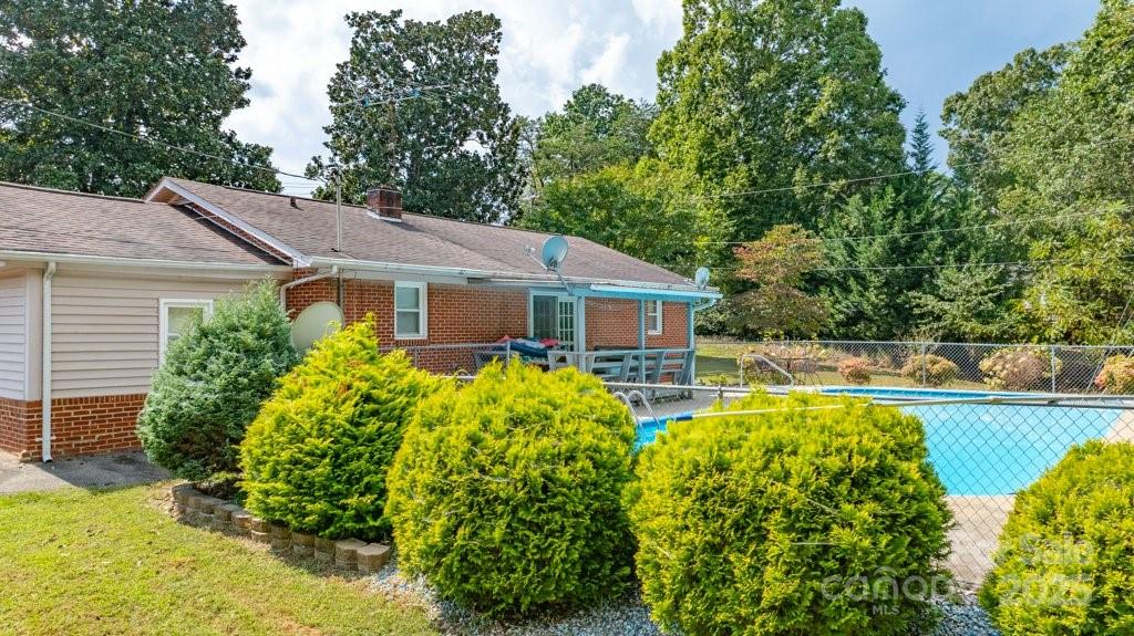 489 Ned Mcgimsey Road Nebo, NC 28761 - Photo 5 of 25 a front view of house with yard and swimming pool