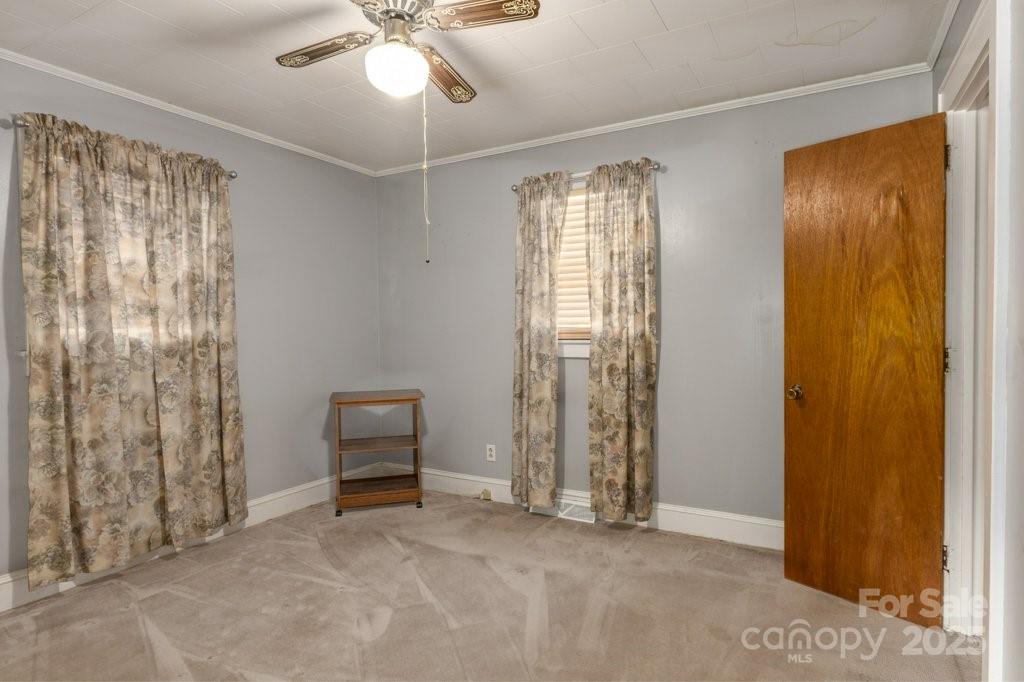489 Ned Mcgimsey Road Nebo, NC 28761 - Photo 10 of 25 a view of room with window and ceiling fan