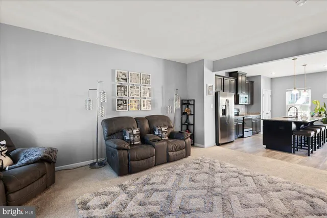 a living room with furniture window and a table