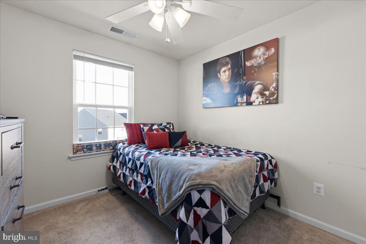 26 Quebec Court Falling Waters, WV 25419 - Photo 20 of 29 a bedroom with a bed and a painting on the wall