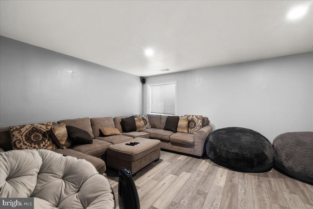 26 Quebec Court Falling Waters, WV 25419 - Photo 24 of 29 a living room with couches and a coffee table