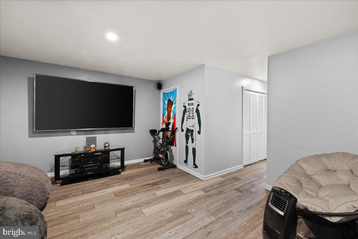 26 Quebec Court Falling Waters, WV 25419 - Photo 25 of 29 a living room with furniture and a flat screen tv