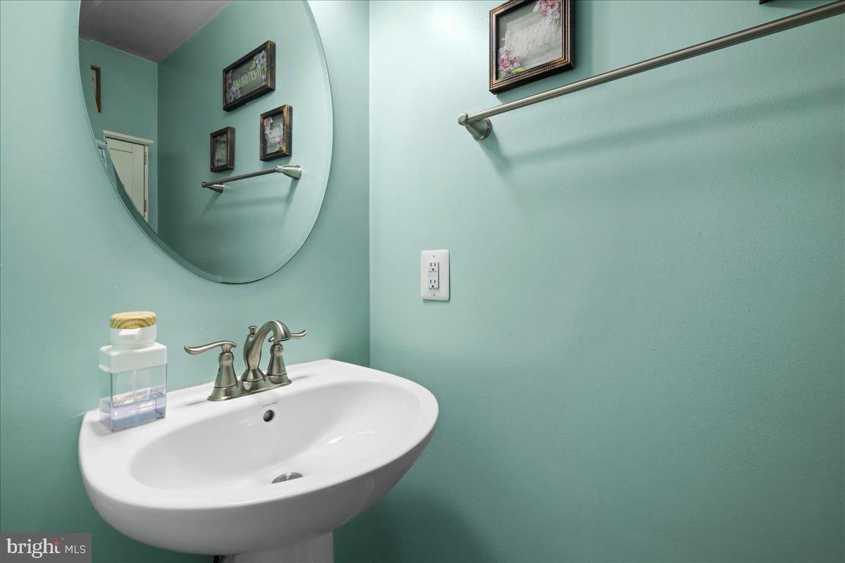 26 Quebec Court Falling Waters, WV 25419 - Photo 26 of 29 a bathroom with a sink and a mirror