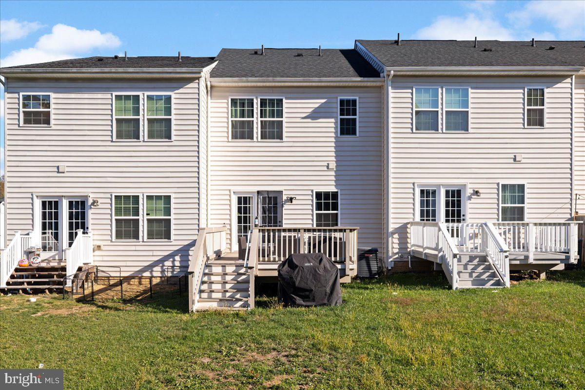 26 Quebec Court Falling Waters, WV 25419 - Photo 27 of 29 a view of a house with a yard and sitting area