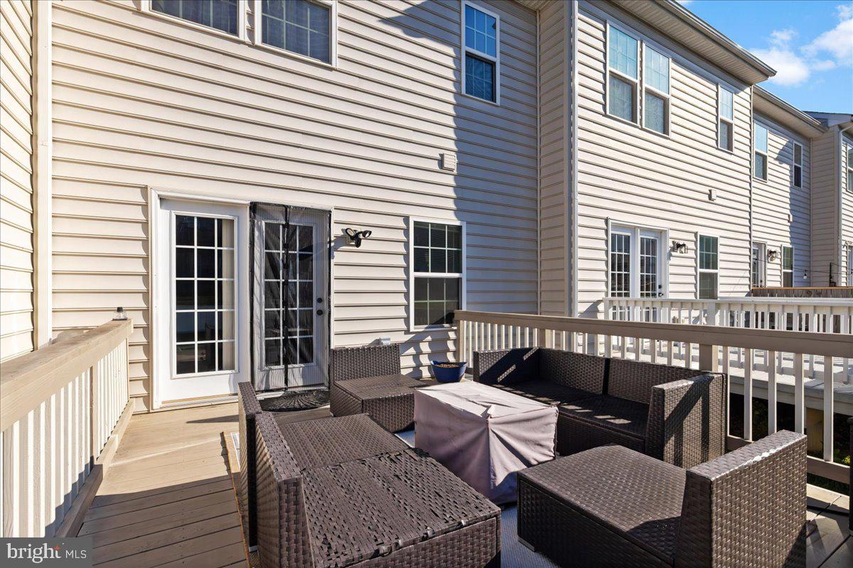 26 Quebec Court Falling Waters, WV 25419 - Photo 28 of 29 a balcony with furniture and wooden floor