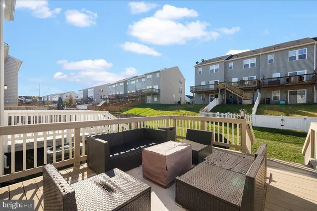 a view of a balcony with two chairs and a table
