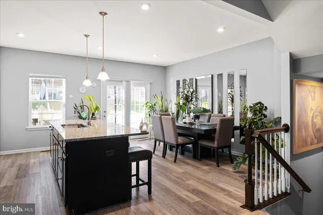 a view of a dining room with furniture and window