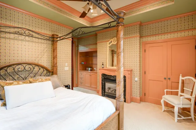 a bedroom with a bed and a chair