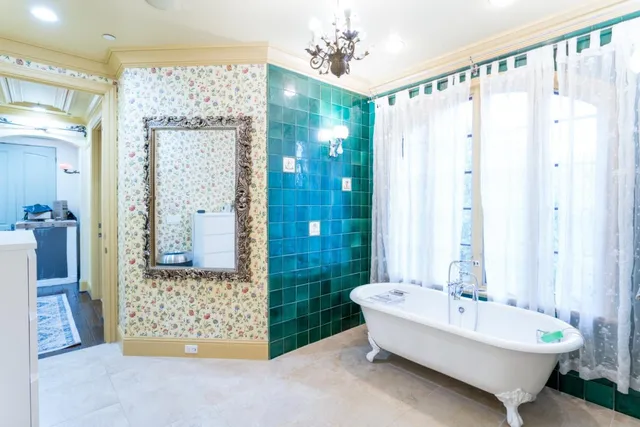 a bathroom with a bathtub shower sink and toilet