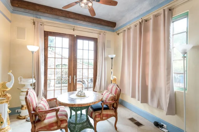 a dining room with furniture and window