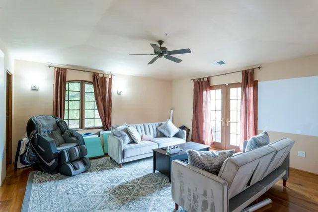 a living room with furniture and a window