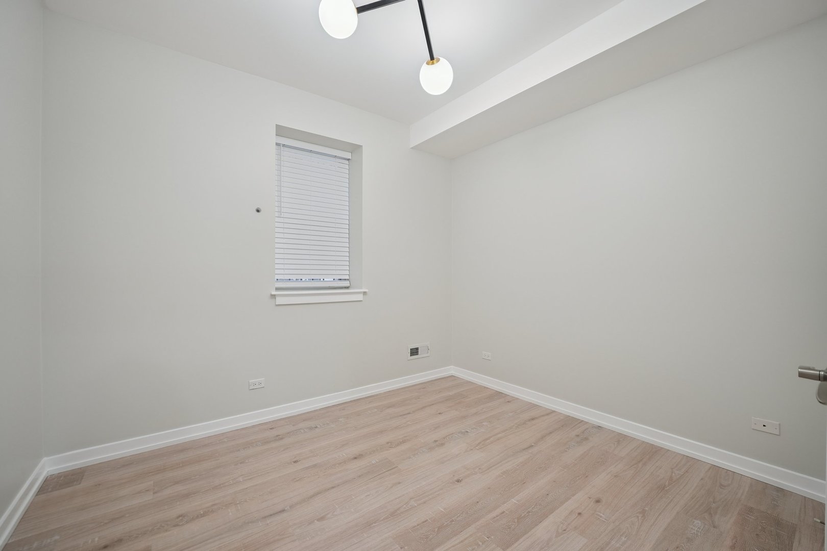 1635 West Warren Boulevard, Unit 1 Chicago, IL 60612 - Photo 11 of 14 wooden floor in an empty room
