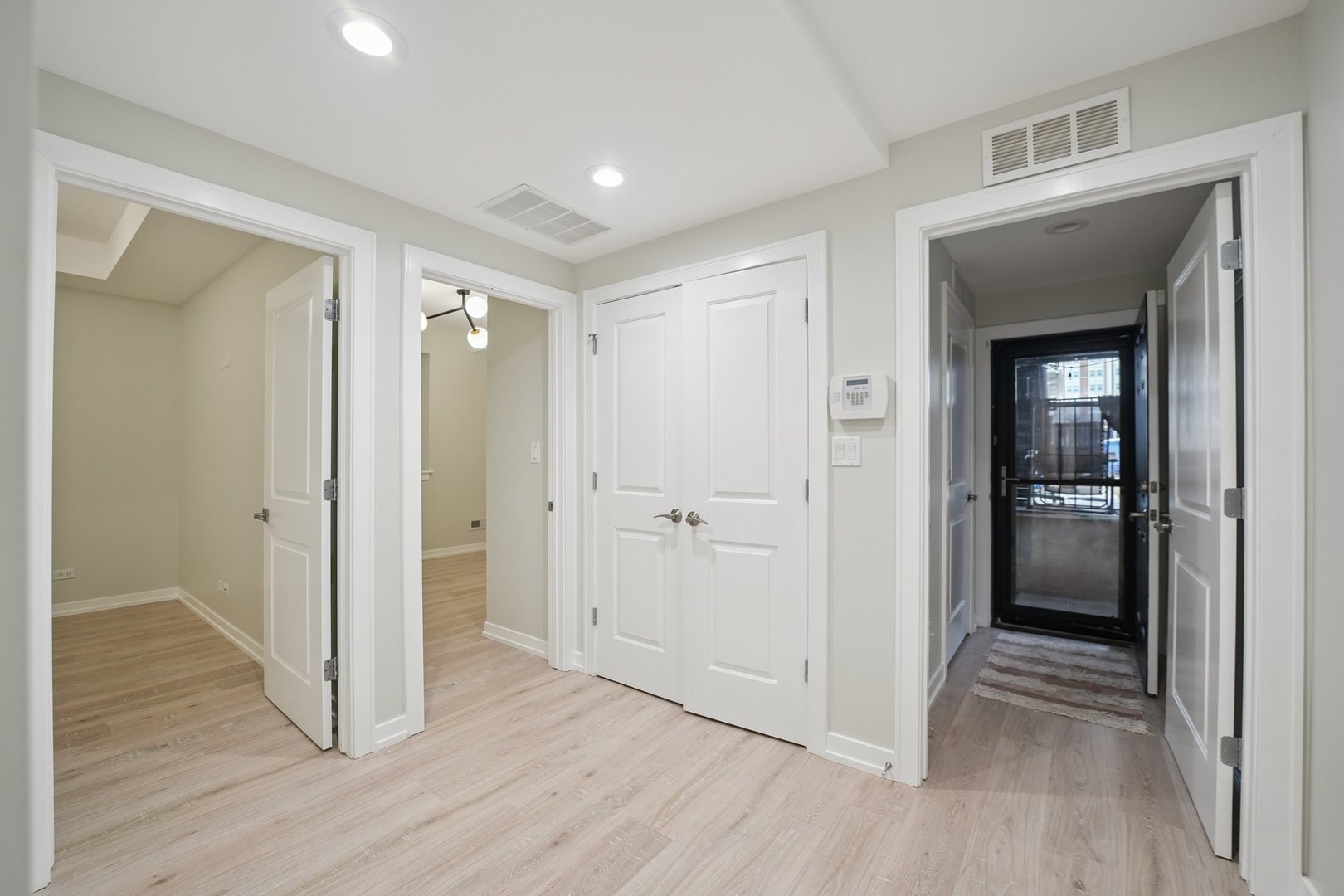 1635 West Warren Boulevard, Unit 1 Chicago, IL 60612 - Photo 12 of 14 a view of hallway with wooden floor