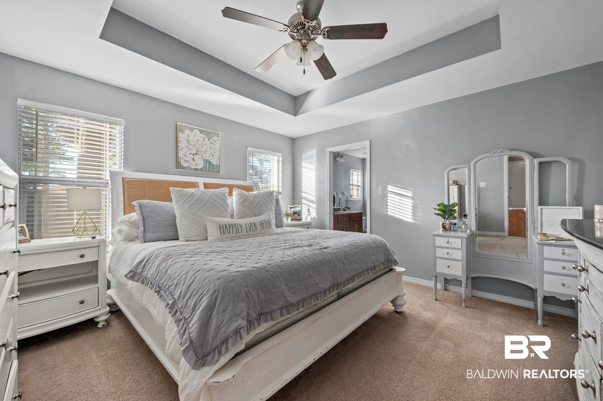 9366 Fox Run Court Semmes, AL 36575 - Photo 17 of 29 Bedroom featuring ceiling fan, a tray ceiling, and multiple windows