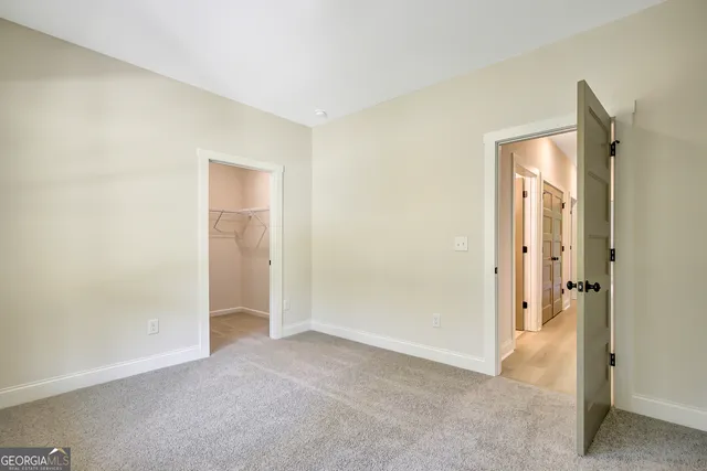 a view of an entryway with wooden floor and a window