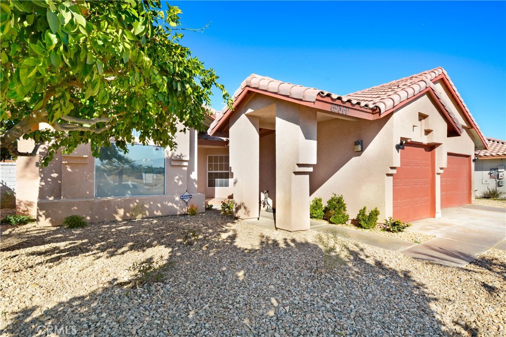 69860 Mccallum Way Cathedral City, CA 92234 - Photo 2 of 25 a view of a house with a yard