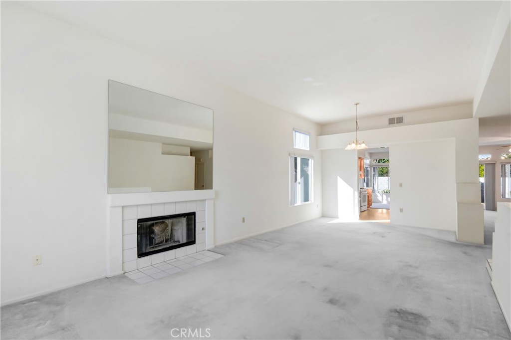 69860 Mccallum Way Cathedral City, CA 92234 - Photo 5 of 25 a view of a livingroom with a fireplace