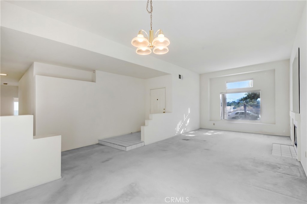 69860 Mccallum Way Cathedral City, CA 92234 - Photo 6 of 25 a view of an empty room with a window