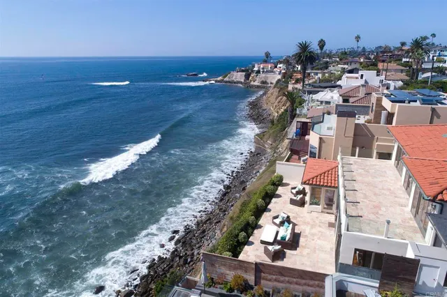 a front view of a residential apartment building with a yard