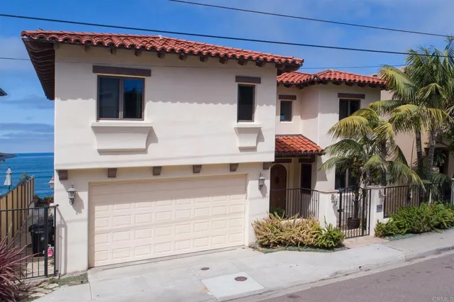 a front view of a house with a garage