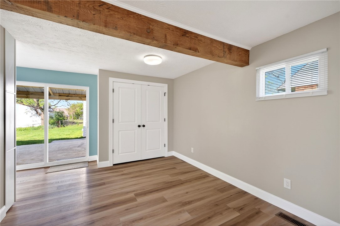 5975 Rosalie Road Dayton, OH 45424 - Photo 7 of 48 This versatile room features warm flooring and convenient outdoor access, ideal for adaptable living.