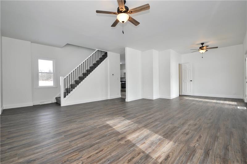 61 Bethel Ridge Road Avella, PA 15312 - Photo 12 of 28 wooden floor in an empty room with a window