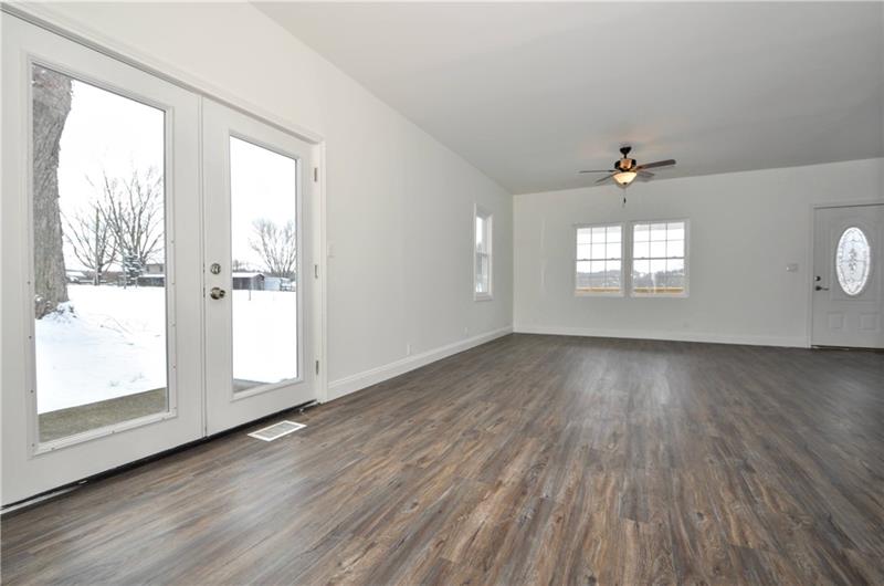 61 Bethel Ridge Road Avella, PA 15312 - Photo 14 of 28 an empty room with wooden floor and windows