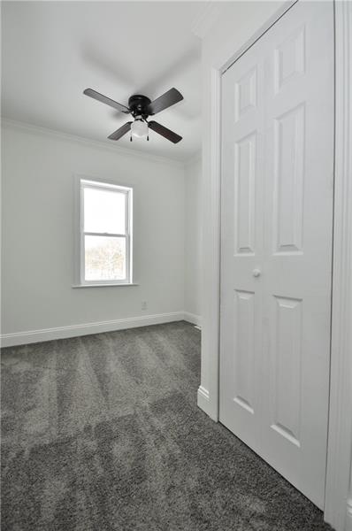 61 Bethel Ridge Road Avella, PA 15312 - Photo 20 of 28 an empty room with windows and fan