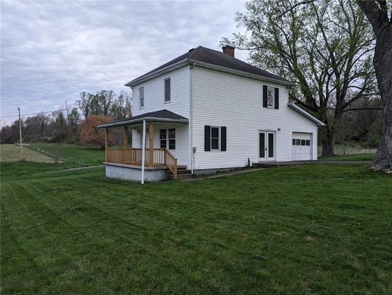 61 Bethel Ridge Road Avella, PA 15312 - Photo 2 of 28 a front view of house with yard and green space