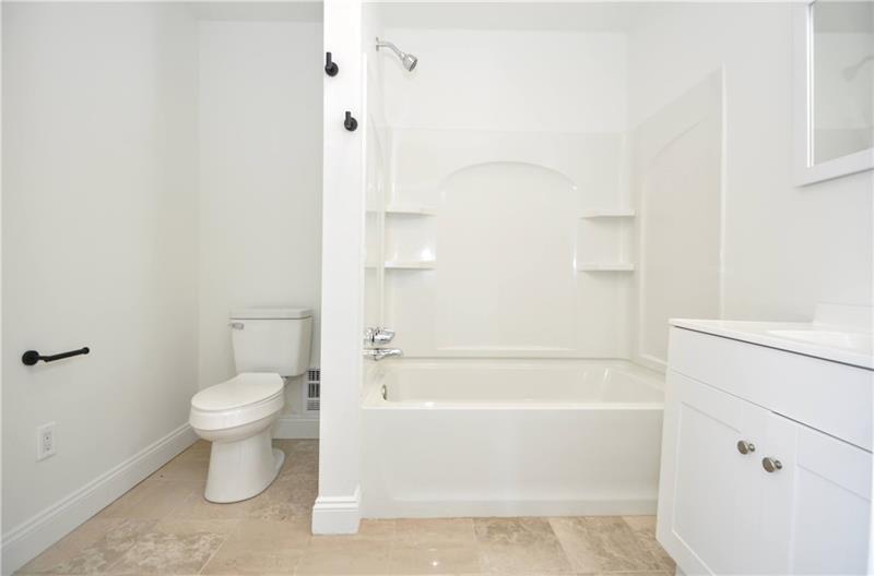 61 Bethel Ridge Road Avella, PA 15312 - Photo 25 of 28 a bathroom with a toilet and a bathtub