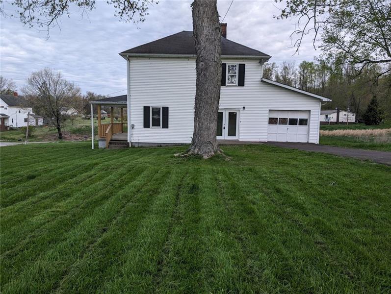 61 Bethel Ridge Road Avella, PA 15312 - Photo 3 of 28 a front view of house with yard and trees