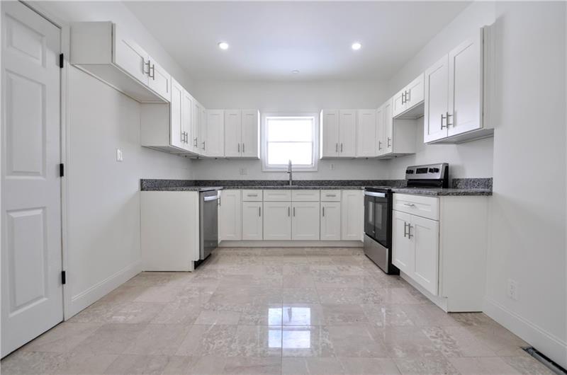 61 Bethel Ridge Road Avella, PA 15312 - Photo 6 of 28 a kitchen with white cabinets stainless steel appliances and a sink