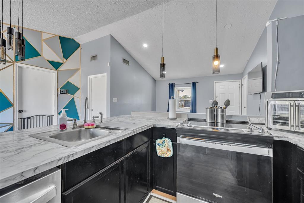 222 West Panama Road Winter Springs, FL 32708 - Photo 12 of 25 a kitchen with kitchen island granite countertop a sink and chairs